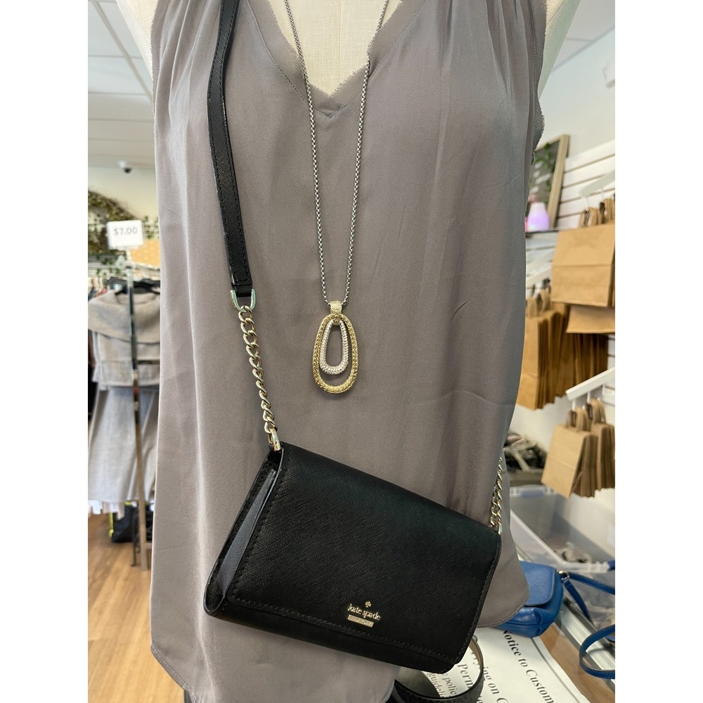Kate Spade Black Crossbody Bag with Gold Chain Detail.